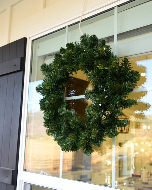 Green wreath on a glass window